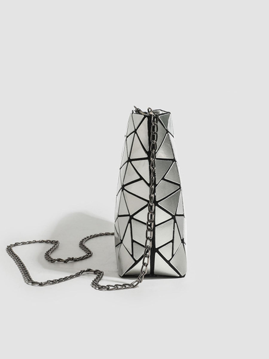 black crossbody bag featuring chain strap and geometric