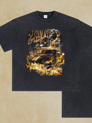Black vintage wash graphic tee with a flaming race car motif and racing text.