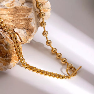 Gold necklace with collar and toggle clasp