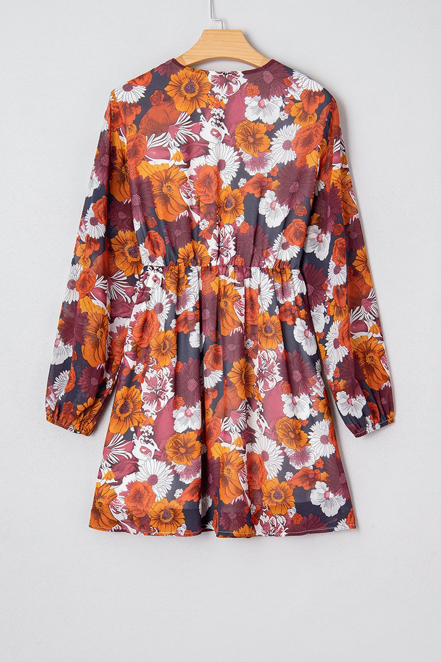 Floral wrap mini dress with puff sleeves in autumnal floral print.