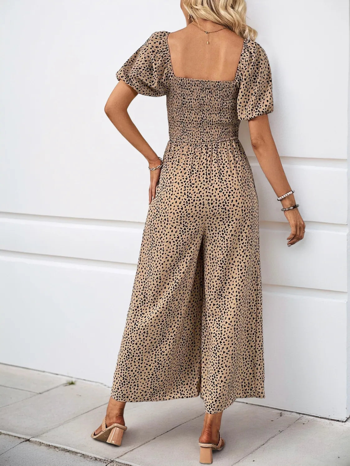 Smocked bodice leopard print jumpsuit with square neck and puff sleeves in tan.