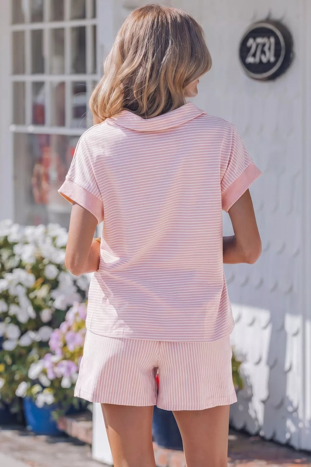 Pink striped cotton polo shirt and drawstring shorts loungewear set for women.