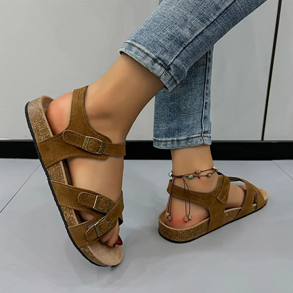 Suede crossover buckle cork sandals in Mocha with adjustable straps and a beaded anklet.