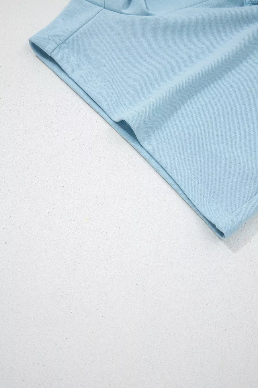 Light blue cotton bikini bottoms with drawstring details and crew neck style.