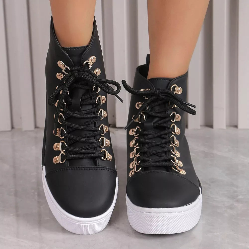 Black lace-up platform sneakers with gold d-rings and white soles