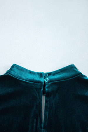 emerald green A-line mini dress with mock neck