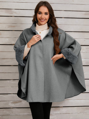 Gray cape coat with faux fur trim on collar and cuffs, open front style.
