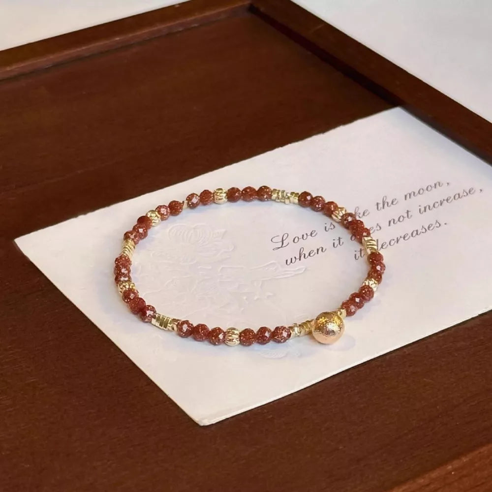 bracelet in reddish brown featuring beaded and fitted fit