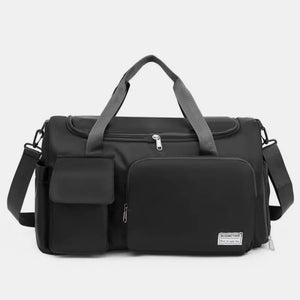 Black canvas duffel bag with multiple utility pockets and adjustable shoulder strap