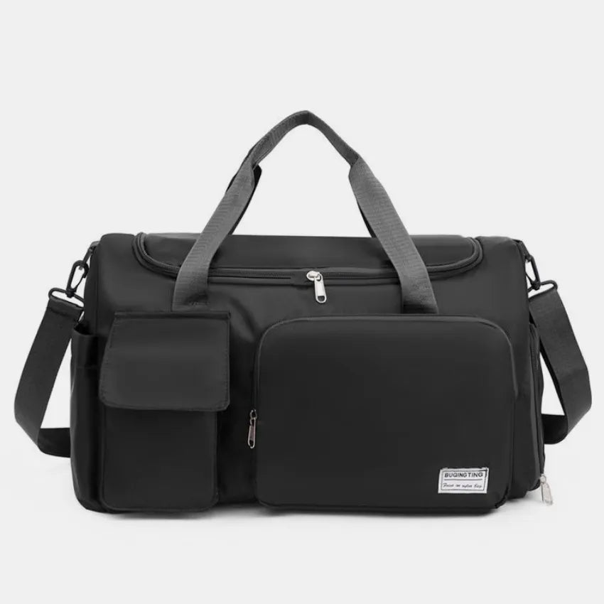 Black canvas duffel bag with multiple utility pockets and adjustable shoulder strap