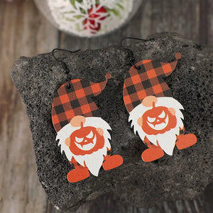 Gnome plaid pumpkin patch earrings with orange and black buffalo check hats and jack-o-lantern faces.