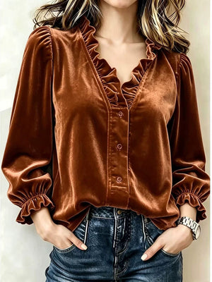 blouse in rust featuring buttoned and relaxed fit