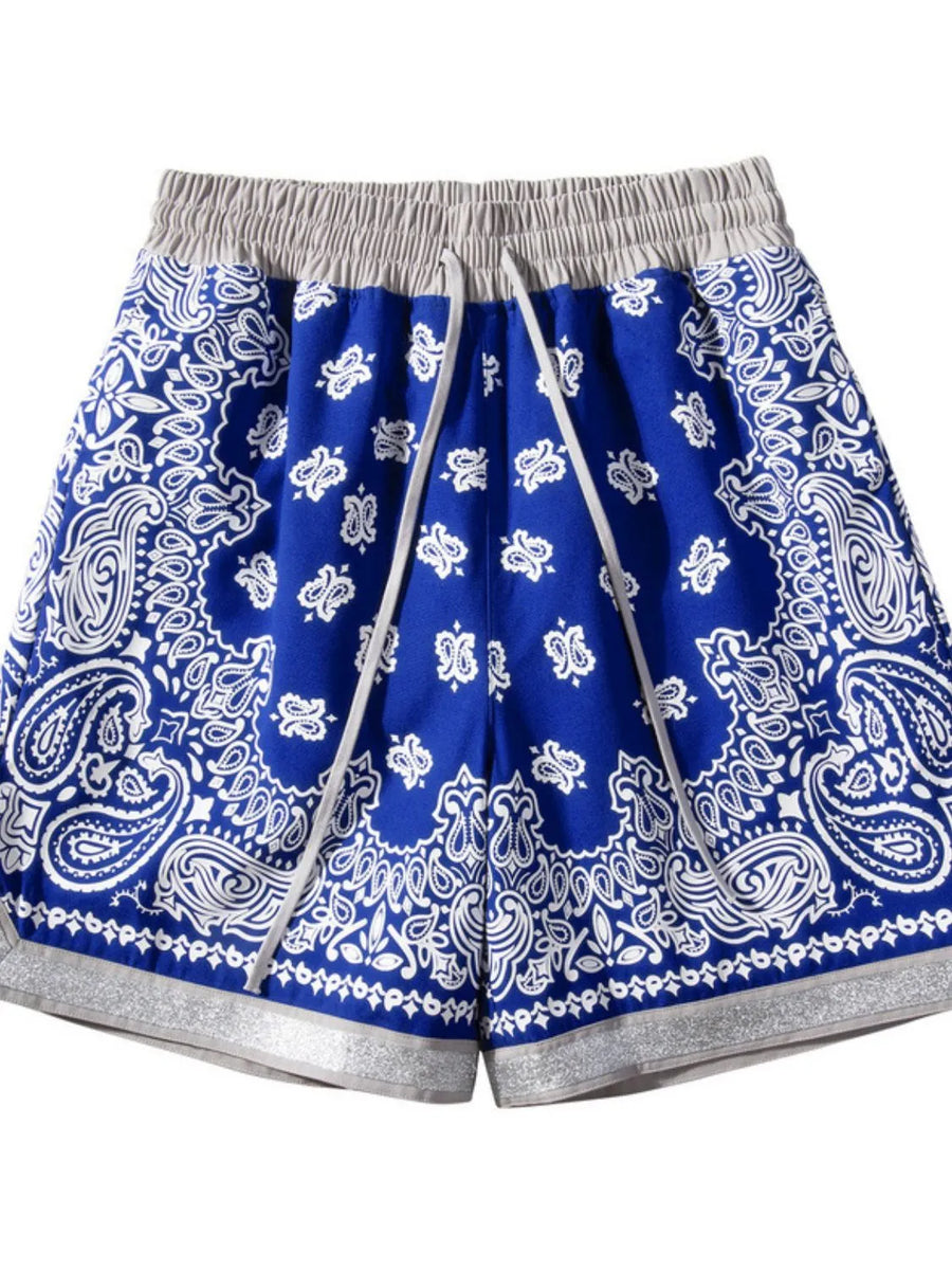 Royal blue bandana print sport shorts with metallic trim and drawstring waist.