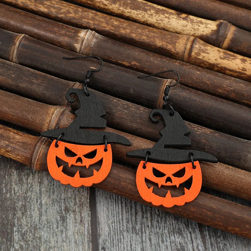Black witch hat pumpkin Halloween earrings made of alloy with carved details.