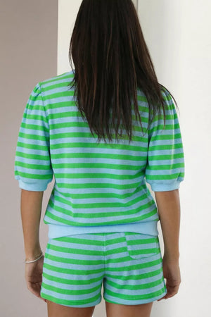 Striped green and blue knit top with puff sleeves and matching shorts.