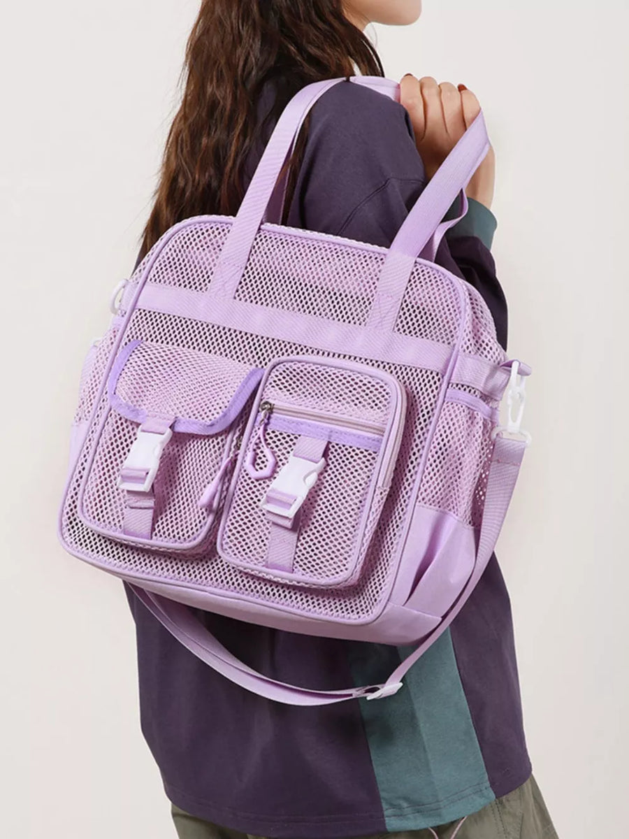 Purple mesh crossbody bag with buckle accents and multiple pockets.
