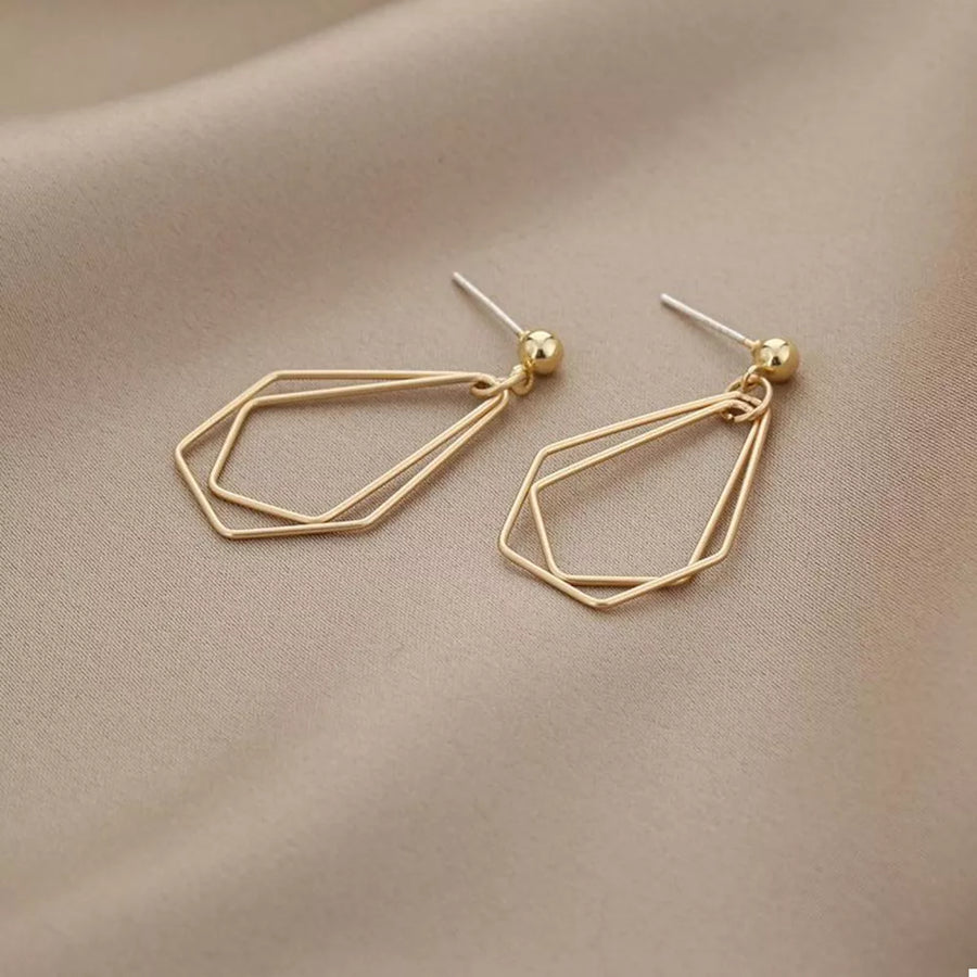 Gold earrings featuring drop earrings and geometric
