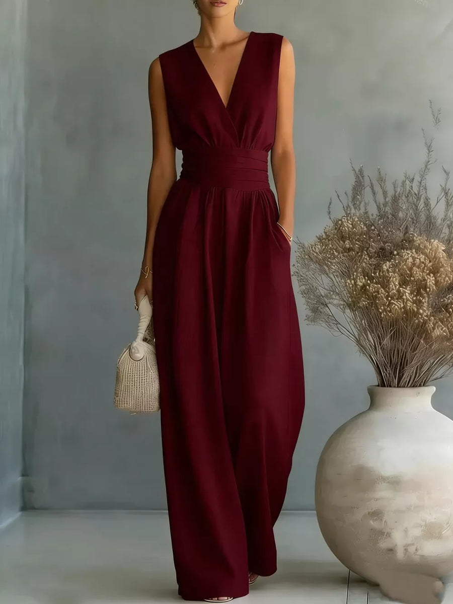 Maroon sleeveless V-neck wide-leg jumpsuit with tie waist and pockets