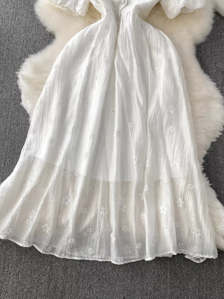 White embroidered puff sleeve midi dress with a-line skirt and button detail
