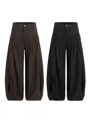 Corduroy wide-leg pleated sweatpants in black and brown with cargo pockets.