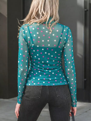Sheer polka dot mock neck shirt in Air Force Blue with pink and white dots, long sleeves.