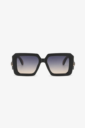 Black geometric facet sunglasses with gradient lenses and embellished temples.