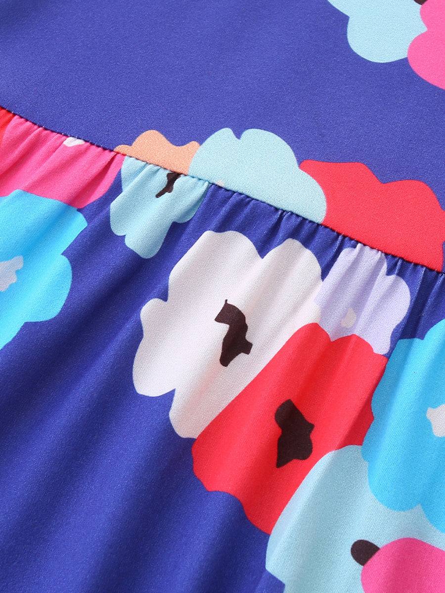Toddler A-line dress with a blue background and a colorful floral print.