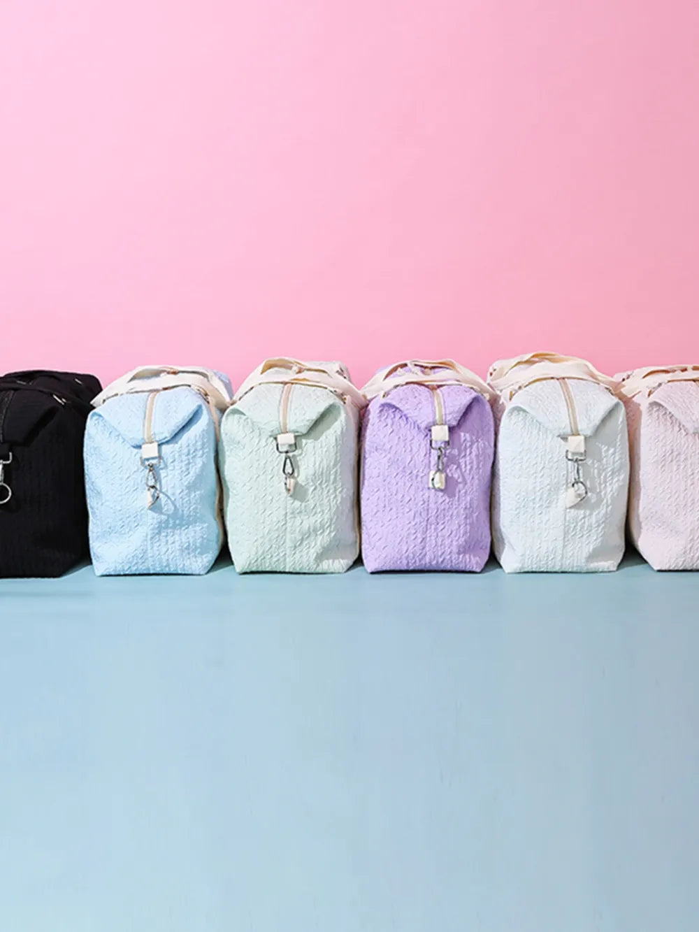 Waffle-weave weekend bag with silver hardware in lavender, pastel blue, light green, black, blush pink, light gray