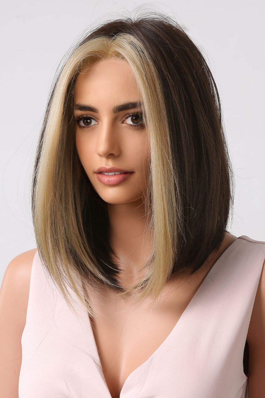 Two-tone bob wig in brown and blonde money piece style, framing the face.