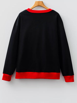 Black sweatshirt with red collar and cuffs, comfortable casual wear.