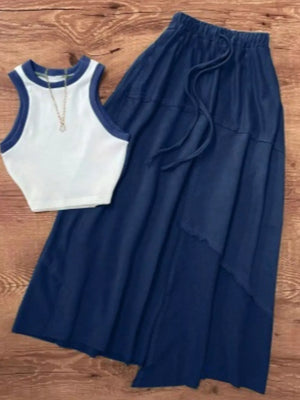White and navy trim tank top with a navy tiered midi skirt with drawstring waist
