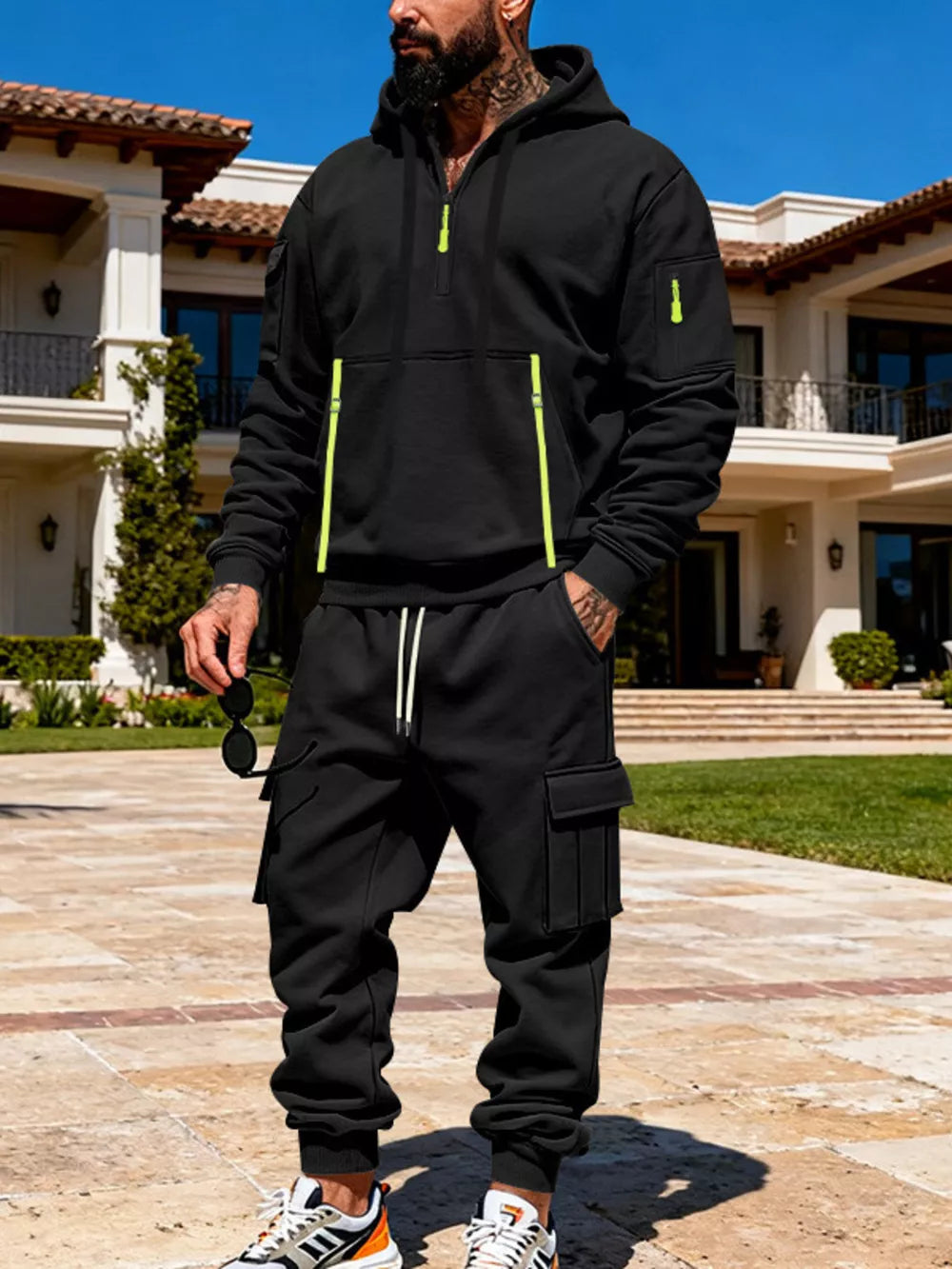 Black half-zip hoodie with neon accents and matching cargo sweatpants set.