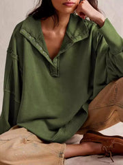 sweatshirt in olive green featuring exposed seam and oversized fit