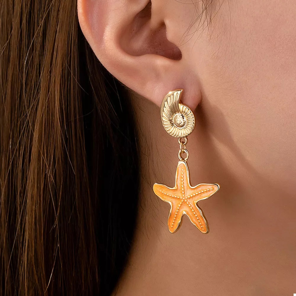 earrings in gold featuring drop design and drop fit