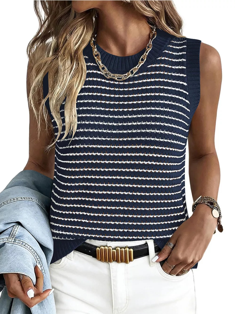 Navy blue and white striped knit sweater vest with a textured pattern and crew neck.