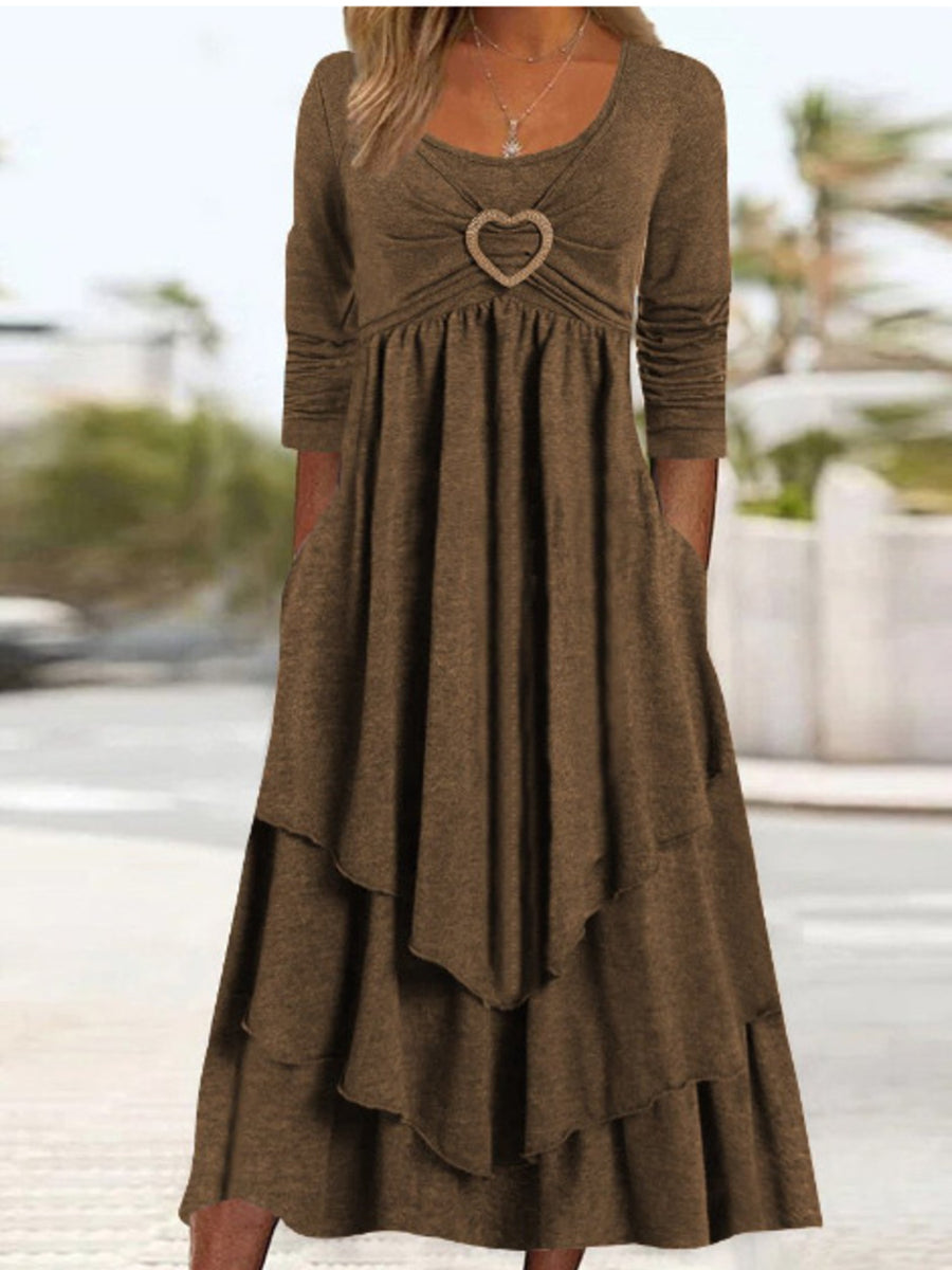 Coffee tiered midi dress with long sleeves, scoop neck, and heart detail at bust.