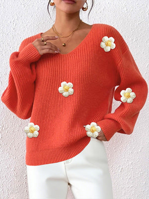 100% polyester Care instructions: Machine wash cold v-neck sweater in Orange with relaxed silhouette