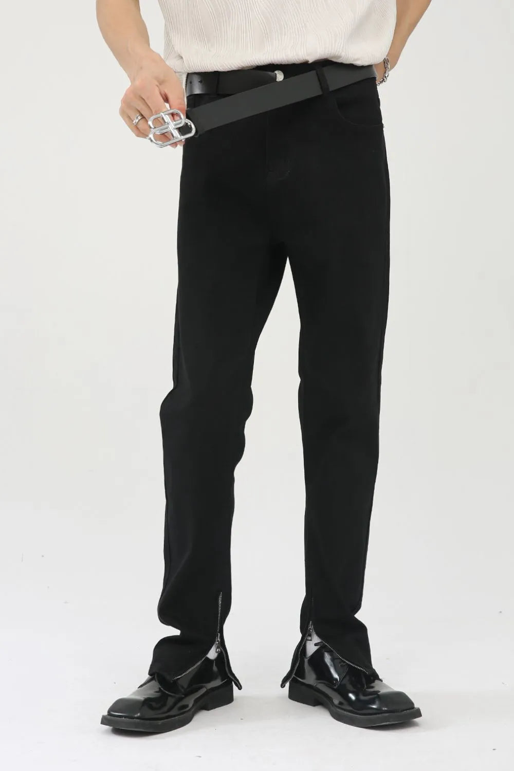 Black denim trousers with zip hem detail