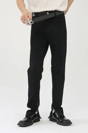 Black denim trousers with zip hem detail