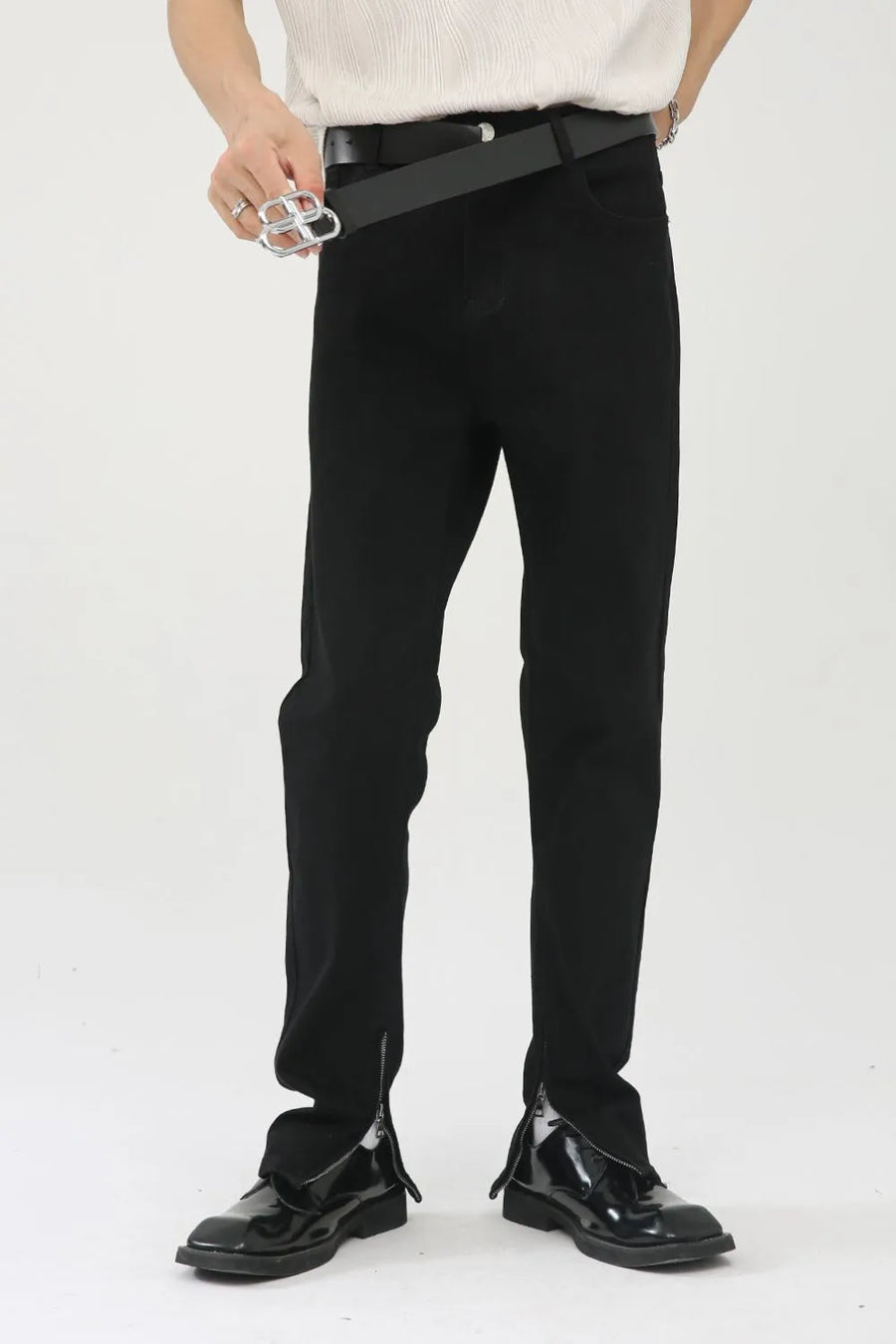 Black denim trousers with zip hem detail
