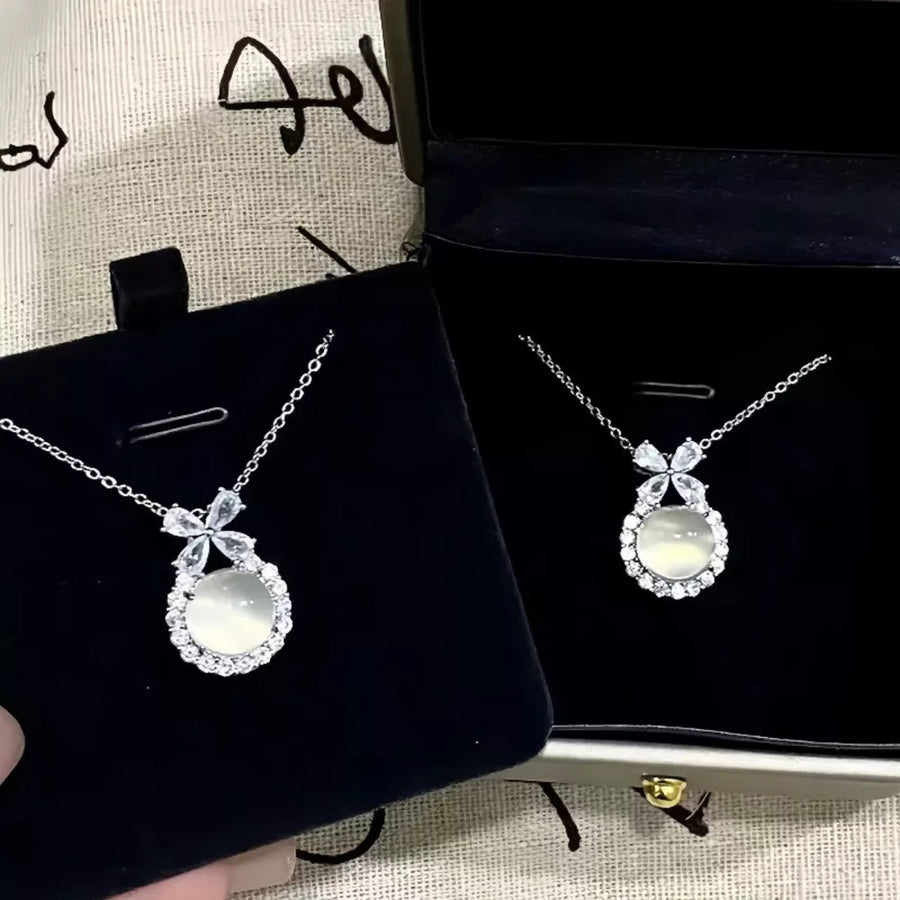 Sterling silver pendant necklace with chalcedony and cubic zirconia in a butterfly design.