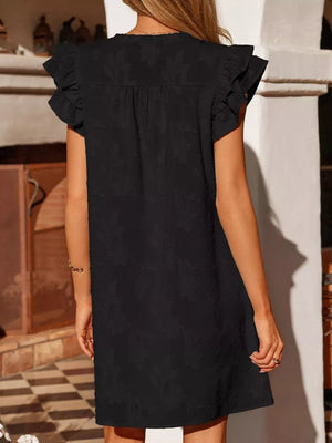 Black floral embossed mini dress with ruffled sleeves and a V-neckline.