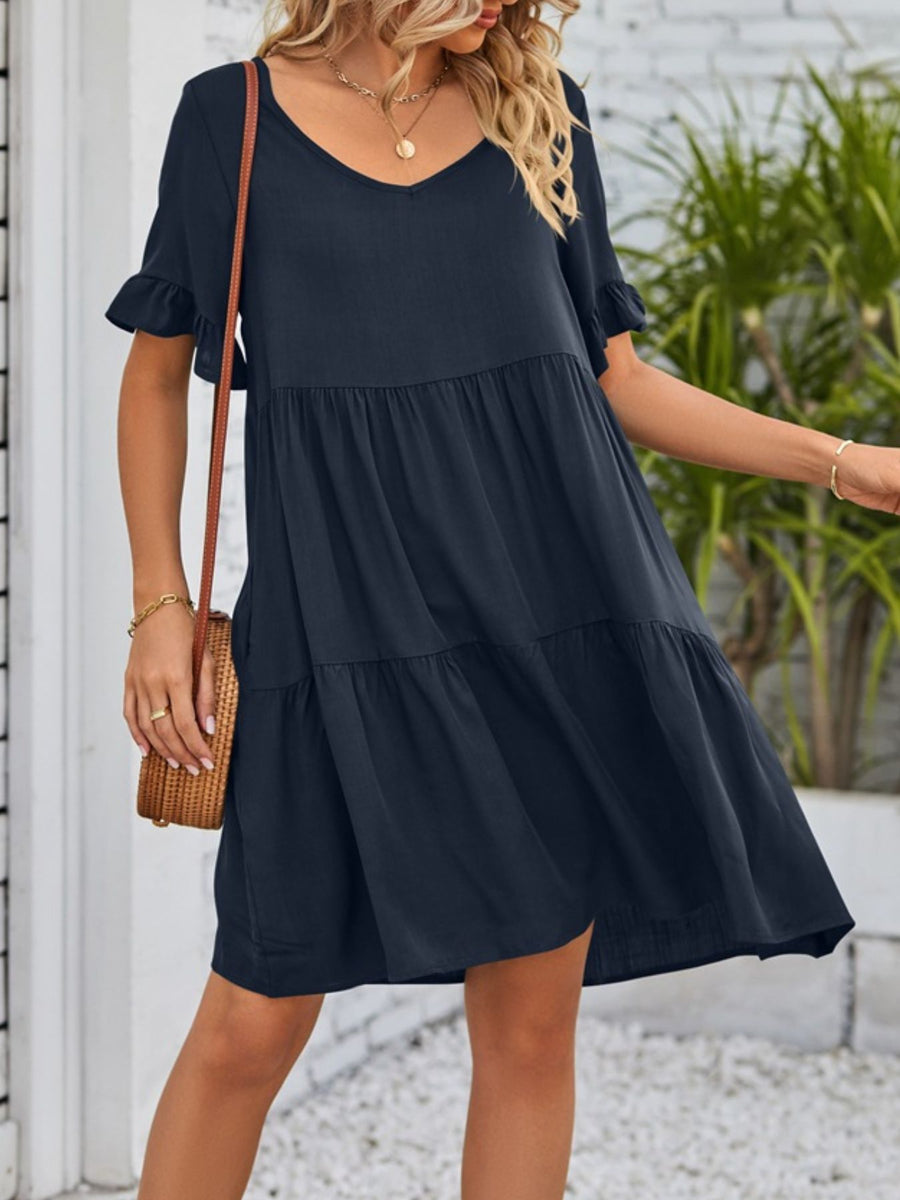 Navy ruffled sleeve mini dress with tiered skirt and V-neck.