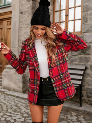 Red plaid single-button blazer with notched lapels, worn over a white turtleneck and black mini skirt.