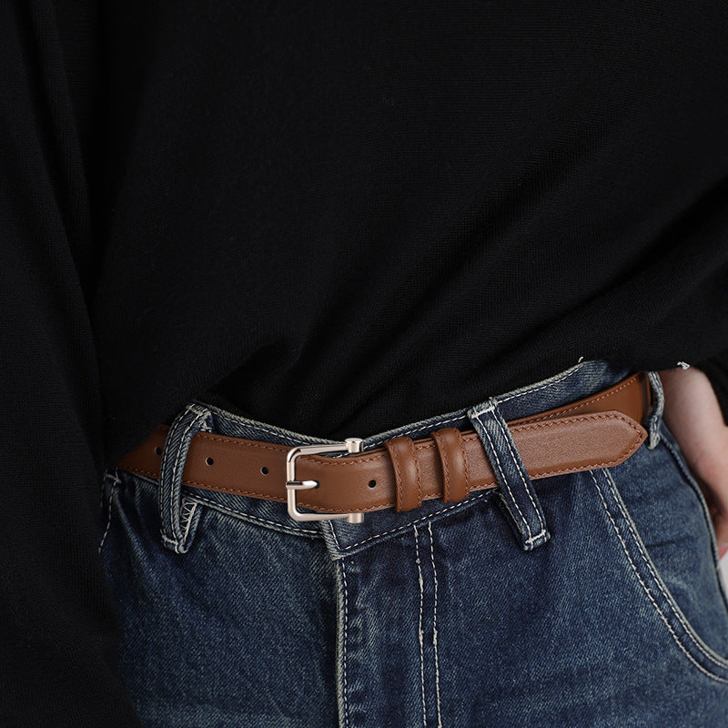 Classic brown cowhide leather belt with silver buckle and adjustable strap.