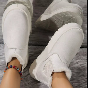 White suede round toe platform ankle boots with faux fur trim.