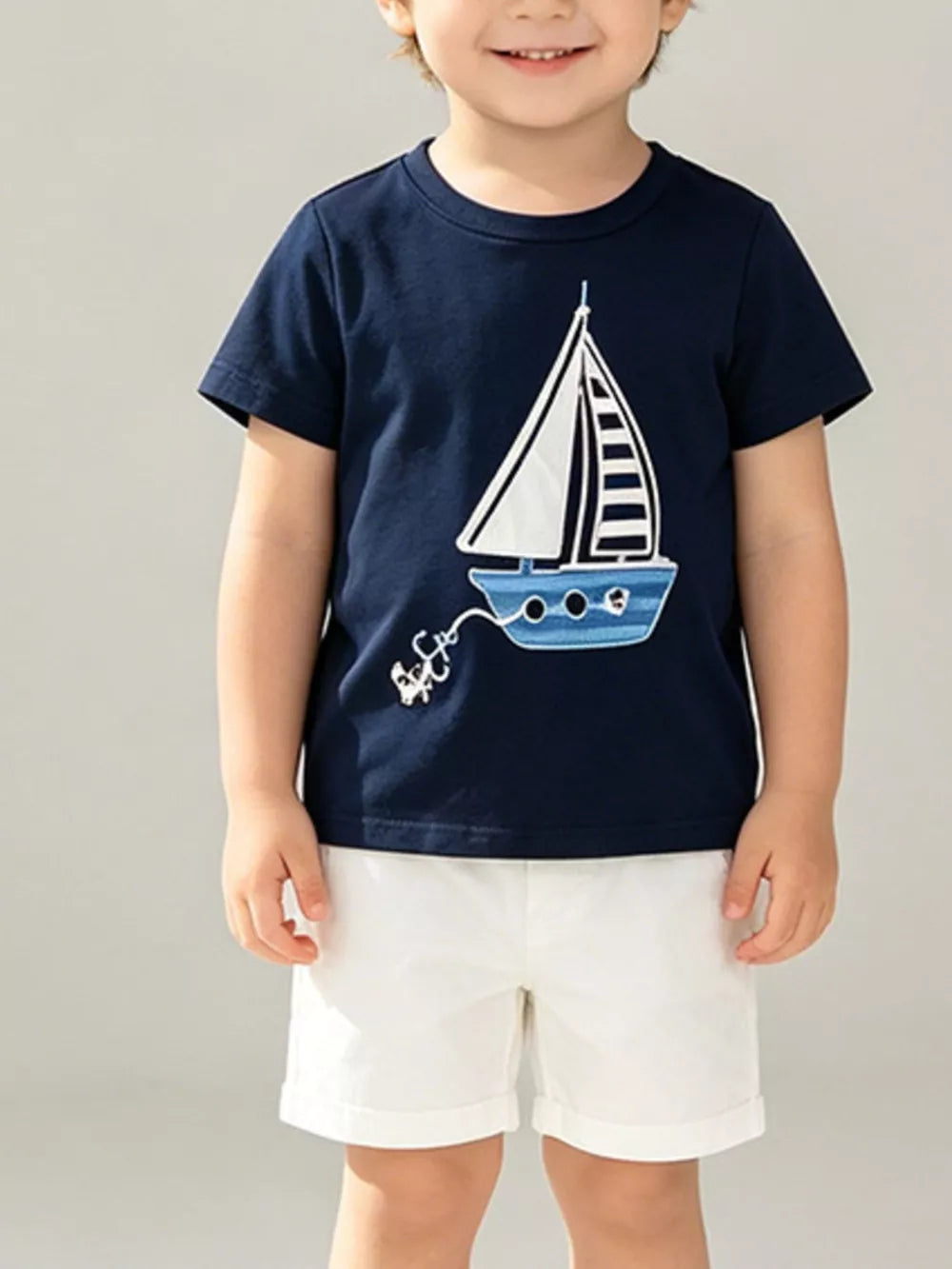 Navy graphic t-shirt for toddlers with a sailboat and anchor design.