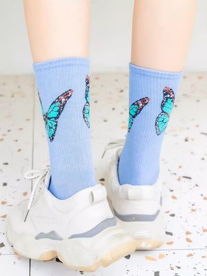 light blue socks with butterfly-print and null