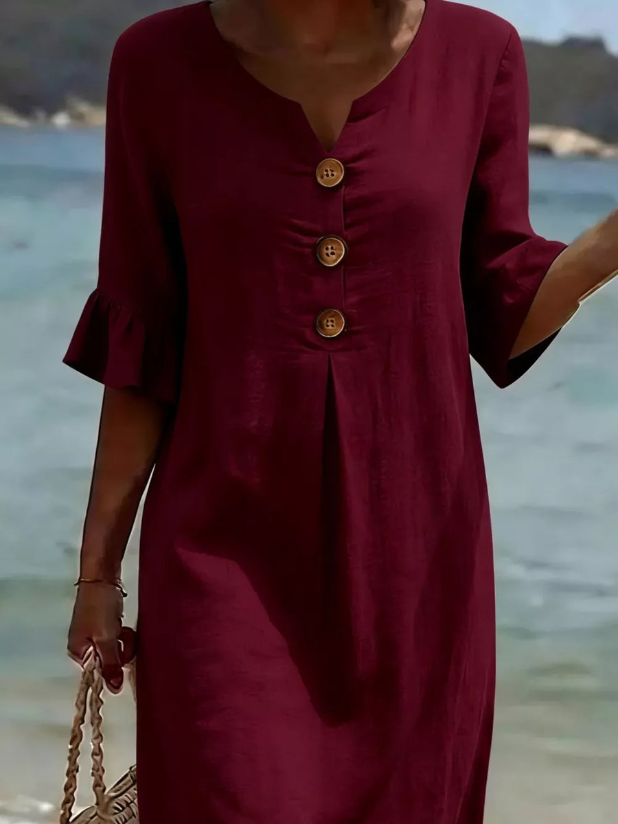 Burgundy ruffled sleeve dress with button detail and V-neck.