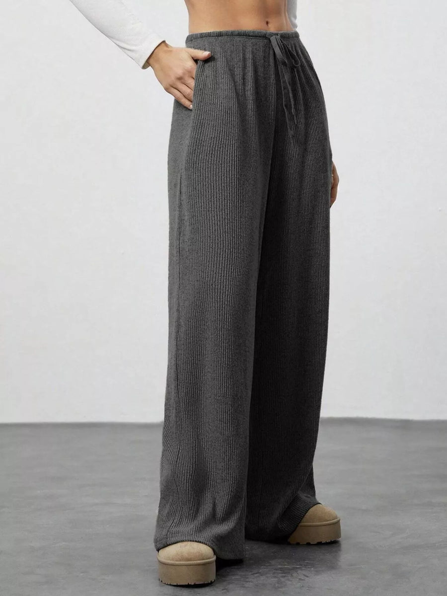 Dark gray ribbed wide-leg pants with drawstring and pockets